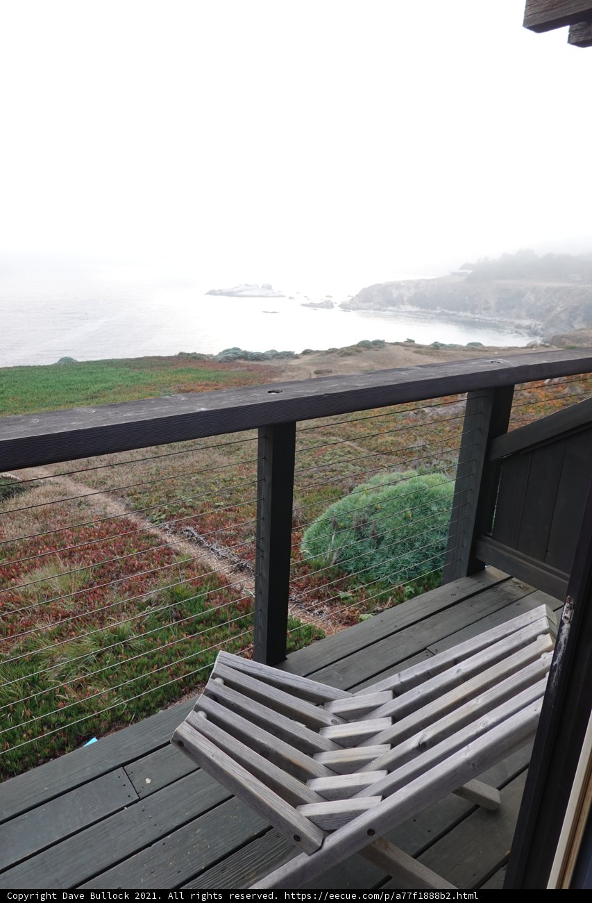 Overlooking the Ocean from a Serene Deck Bench