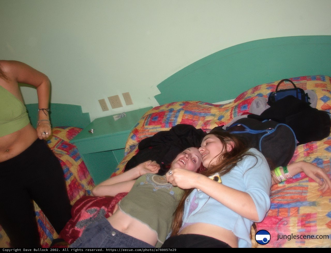 Female Bonding on a Cozy Bed