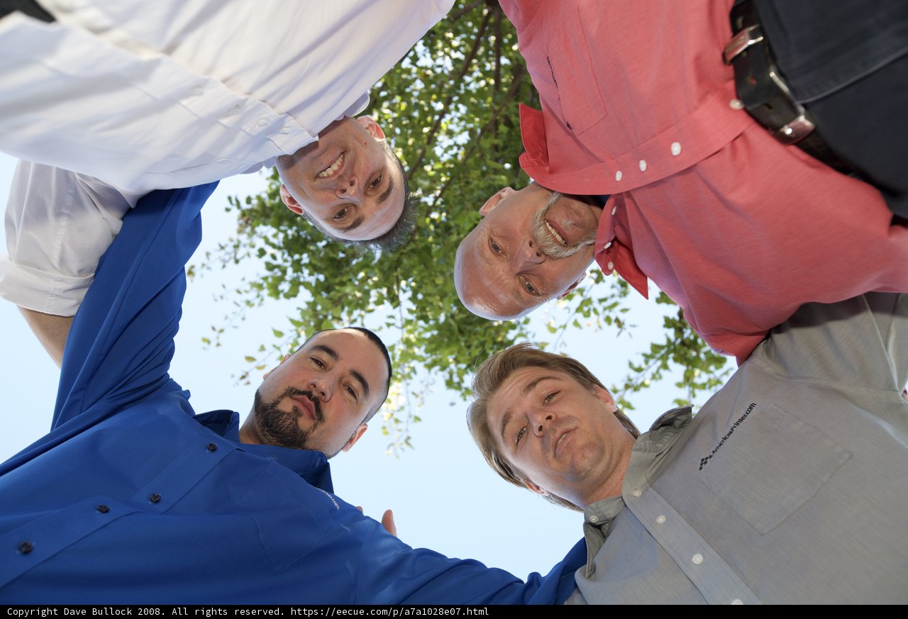 Group of Men Pose for a Graduation Photo Outdoors