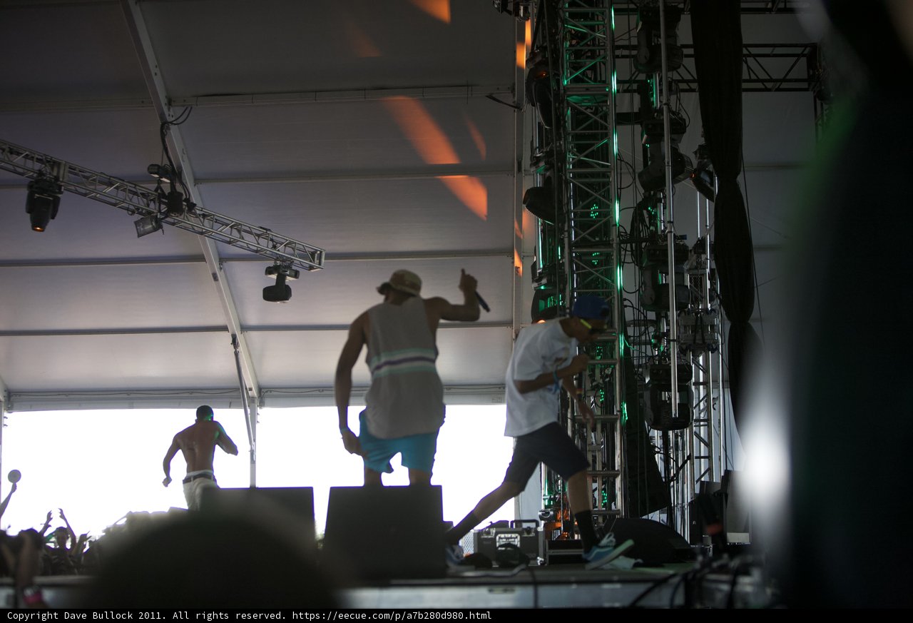 Stage Lights Shining Down on Crowd and Performers