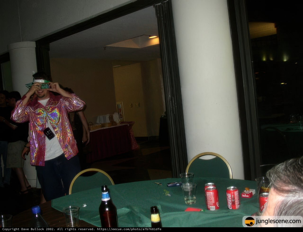 Pink Jacketed Man at Dining Table