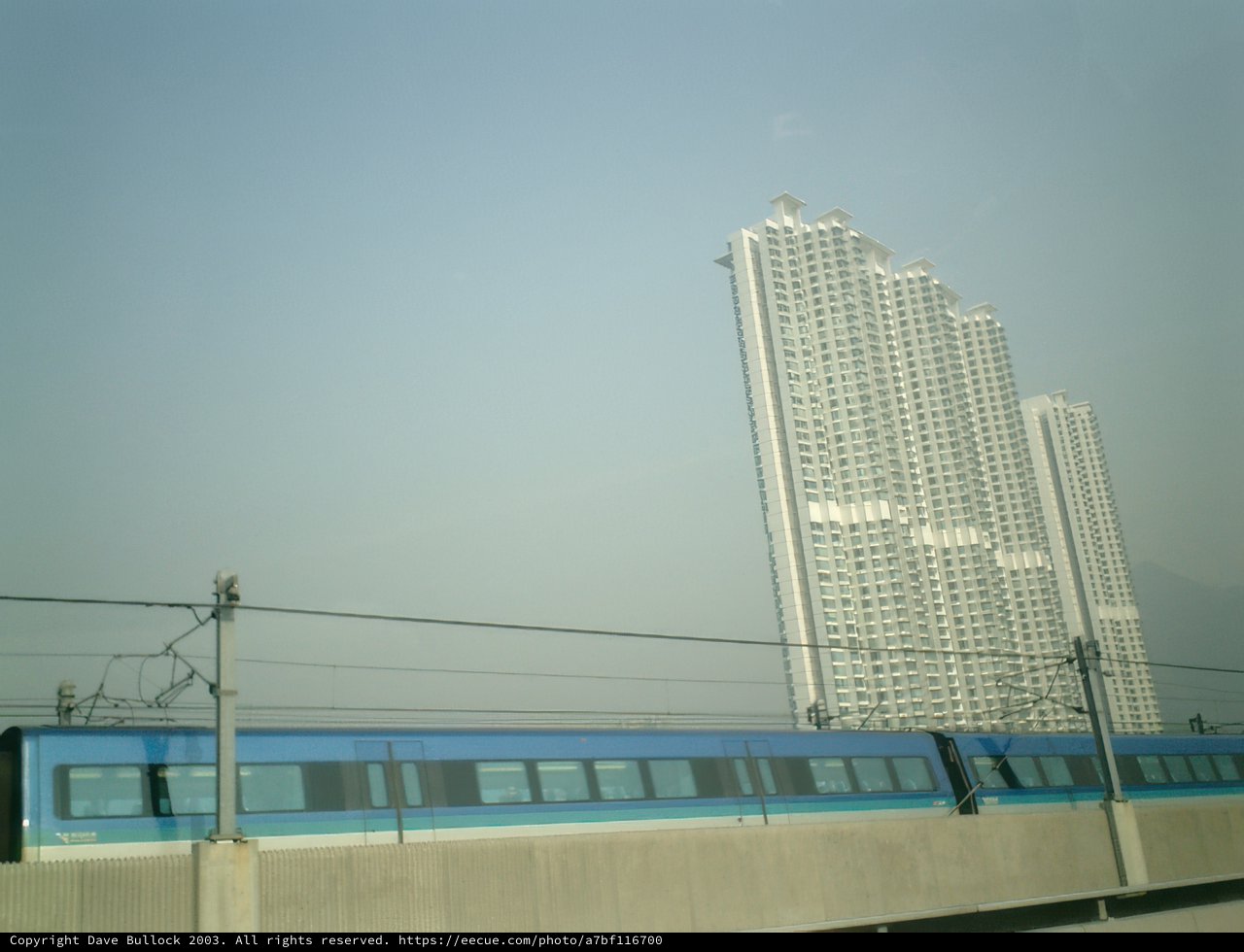 Train Traveling Through Urban High Rises