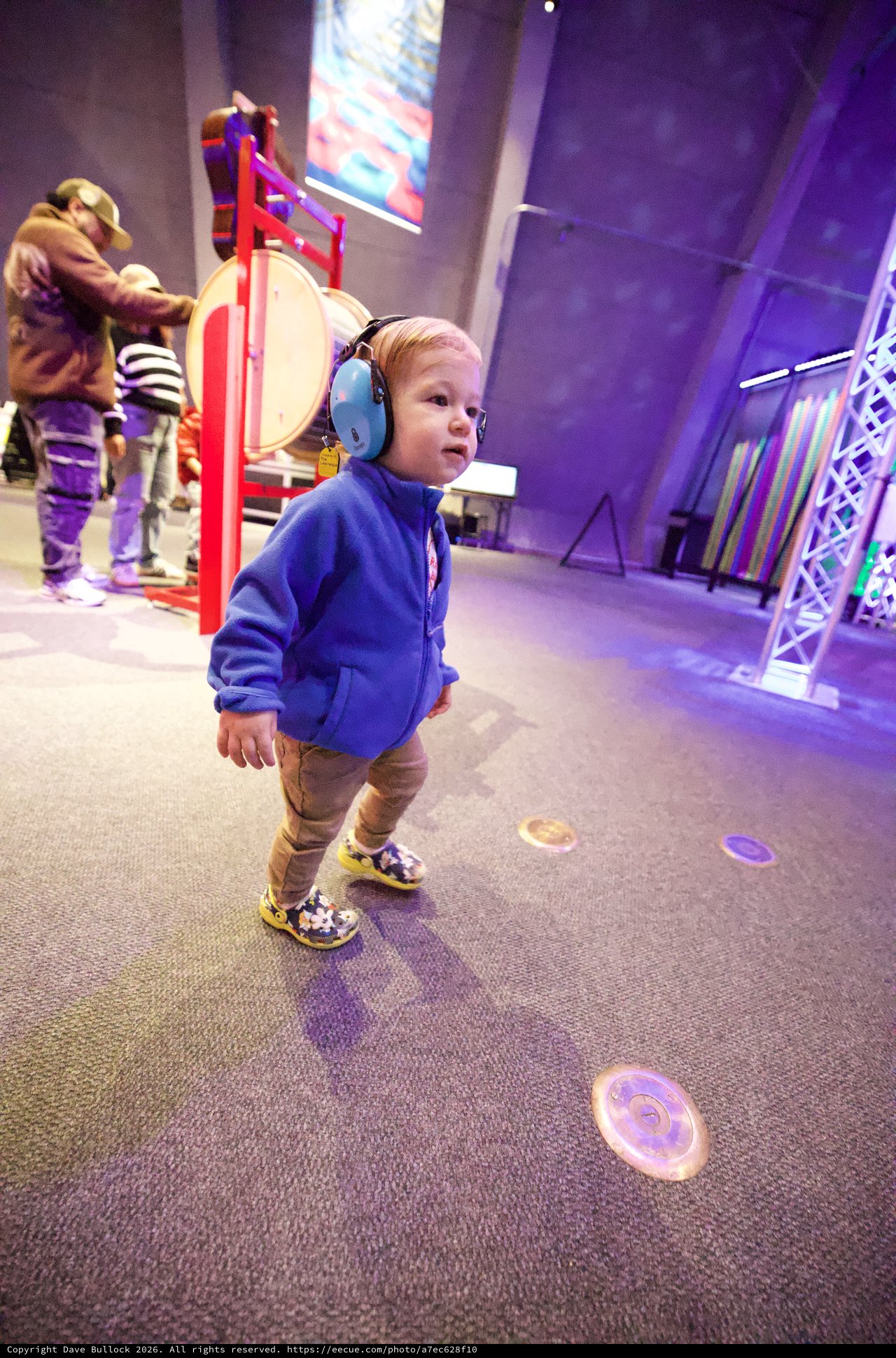 Young Child Exploring Interactive Museum Sound Exhibit