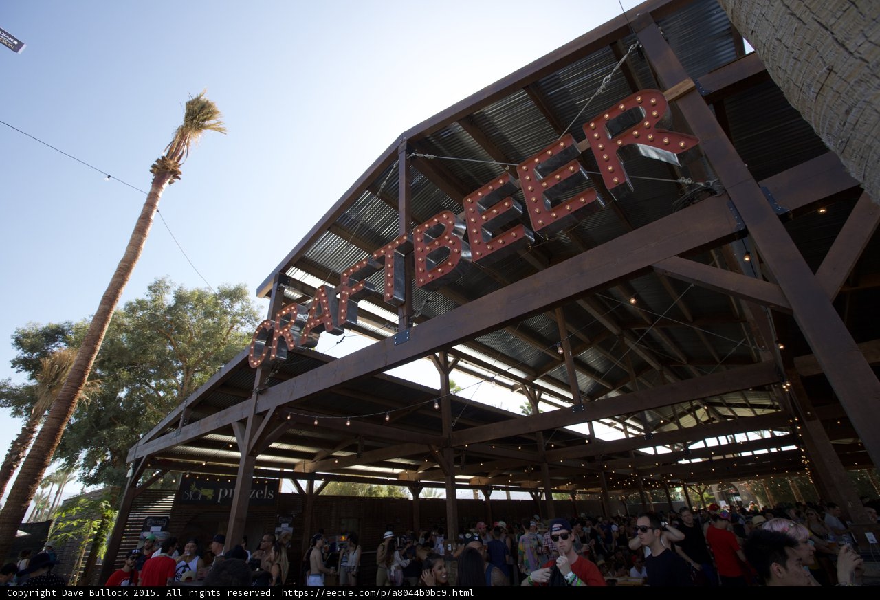 Thirsty Crowds Gather at Beer Sign