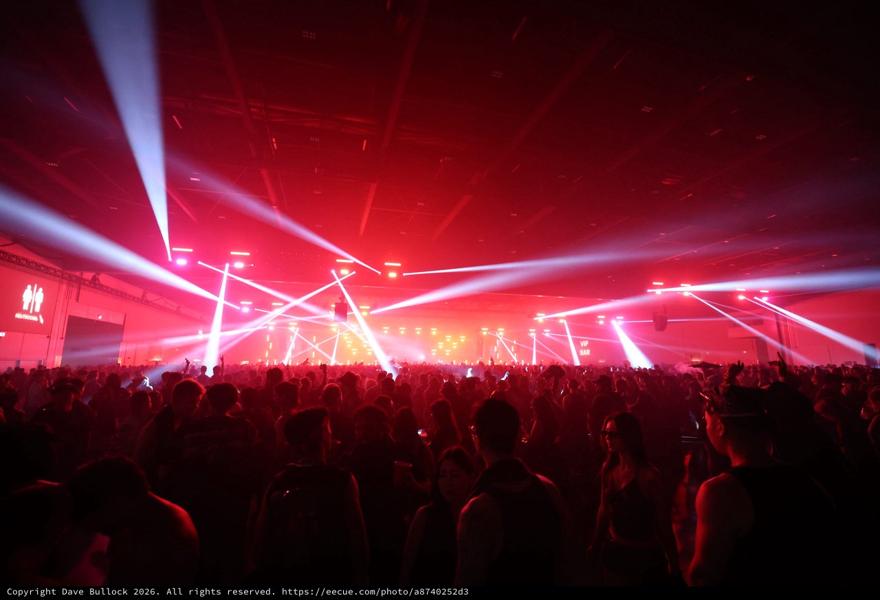 Massive Crowd Ignites Under Red Light Storm