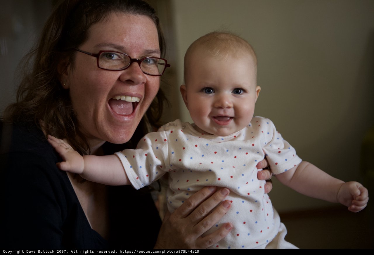 Joyful Mother and Baby Share Infectious Laughter