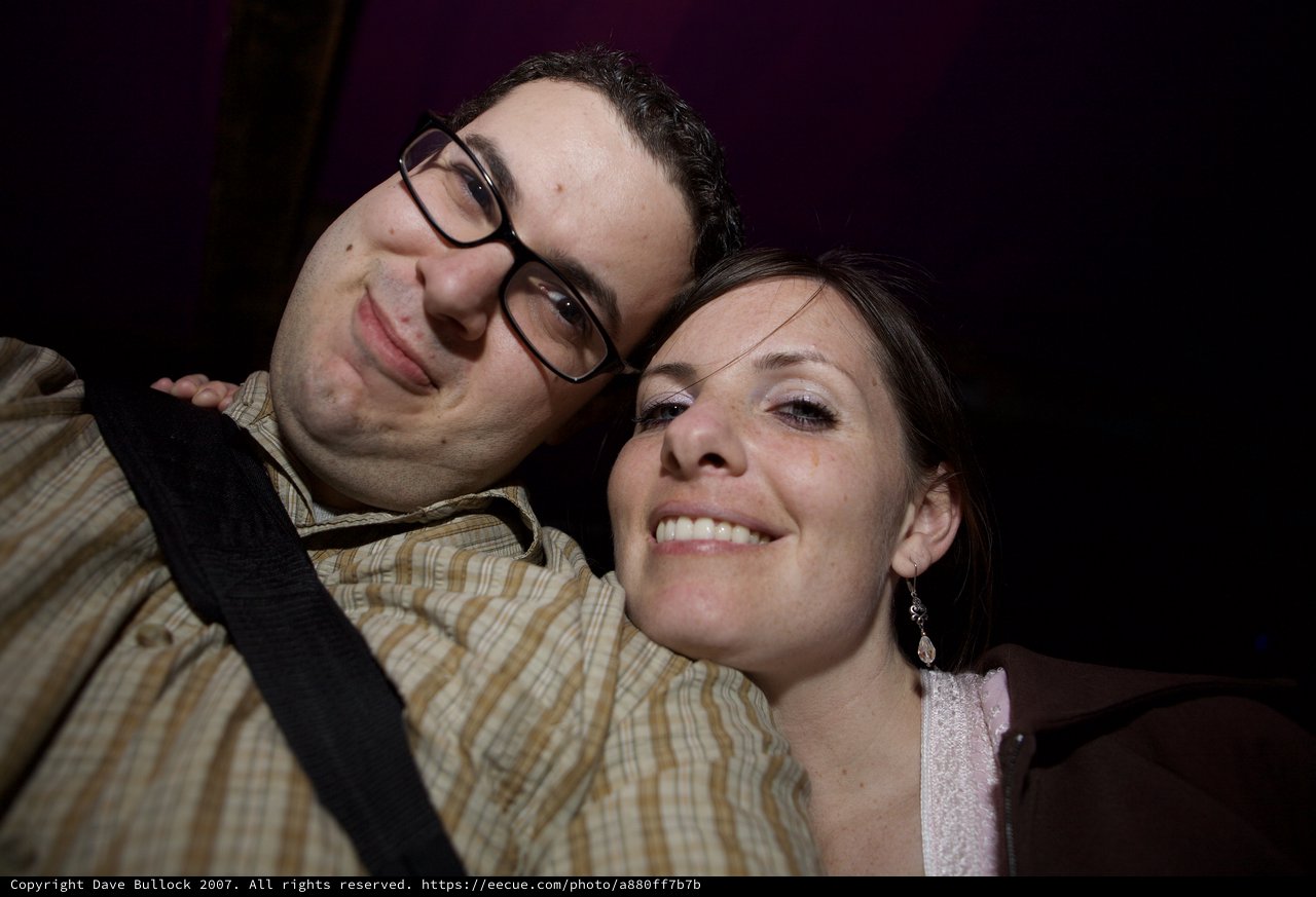 Smiling Couple Close-Up at Nighttime Event