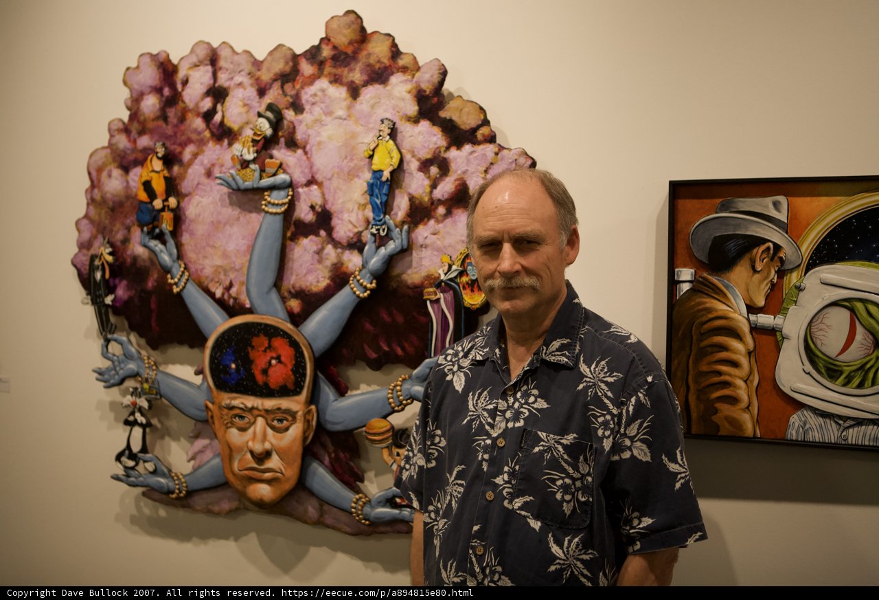 Man next to Portrait of a Head