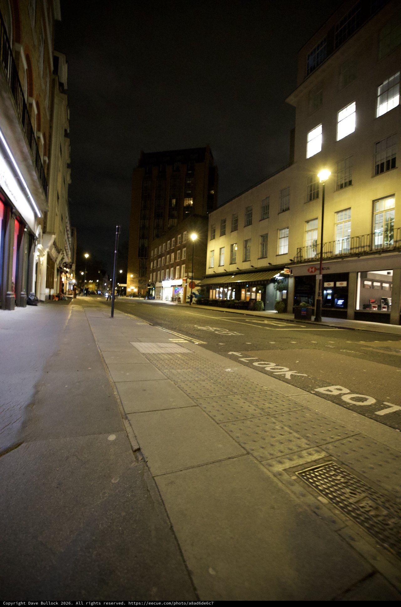 Quiet London Street at Night with Illuminated Buildings