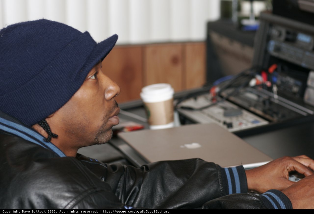 Black Jacketed Man Typing Away
