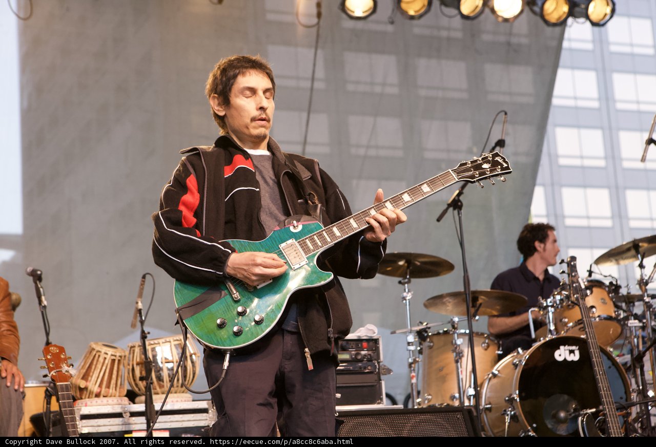 The Ultimate Music Performance: Man playing a Guitar on Stage
