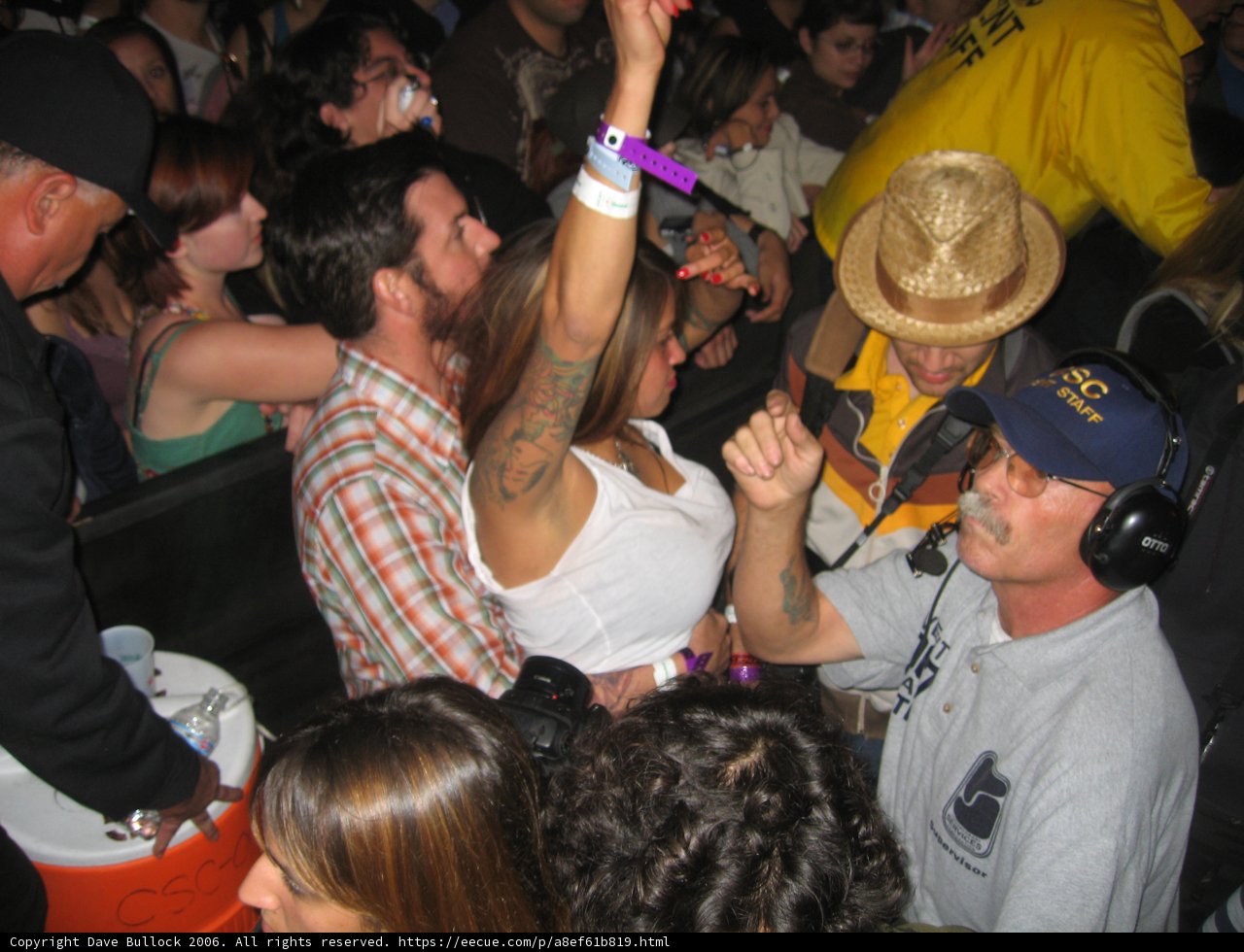Hat-wearing man blends in with the crowd