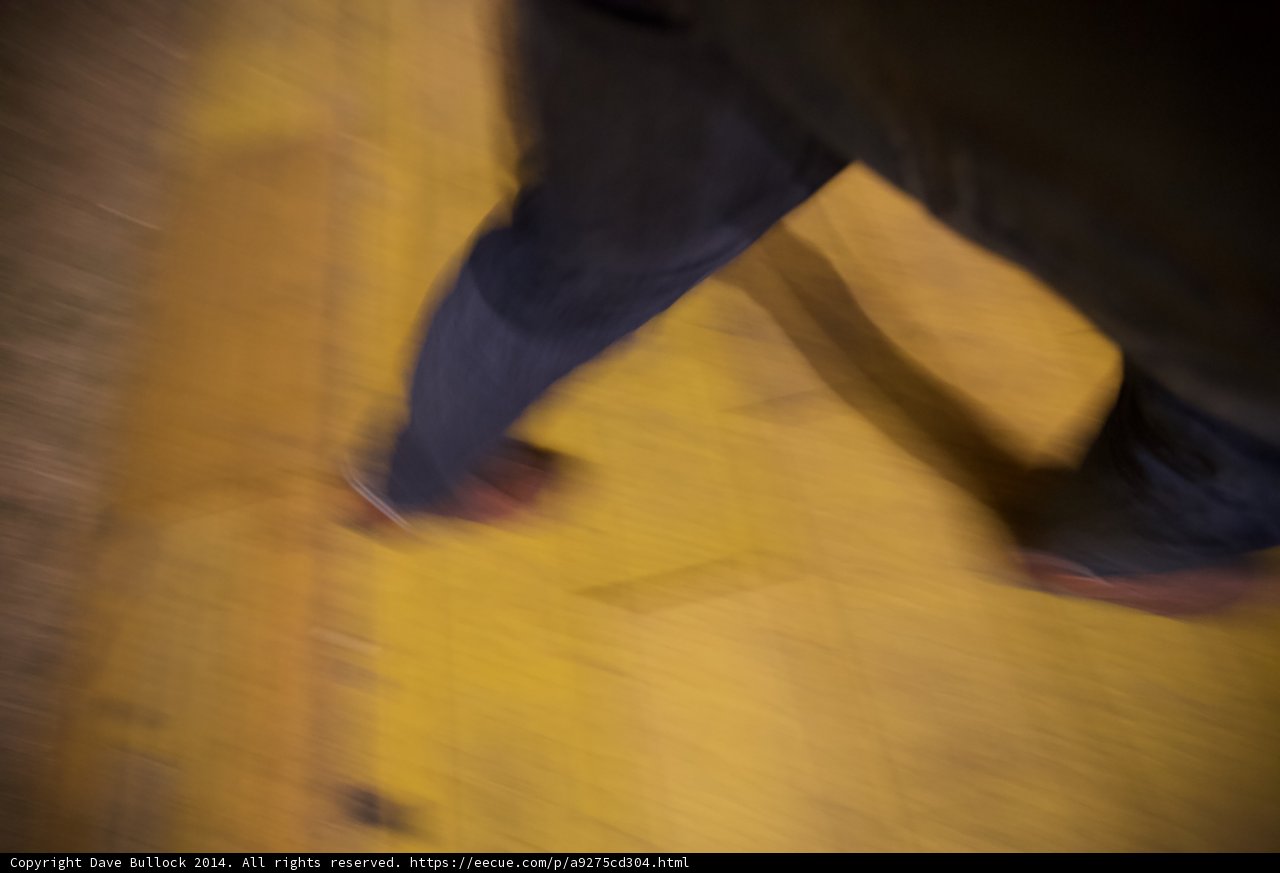Blurred Steps on a Yellow Hardwood Floor