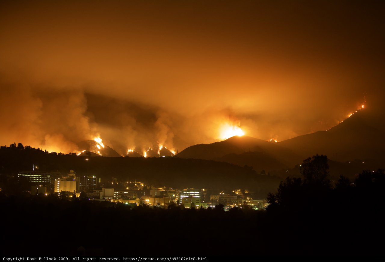 Devastating Wildfire in the Mountains and Cityscape