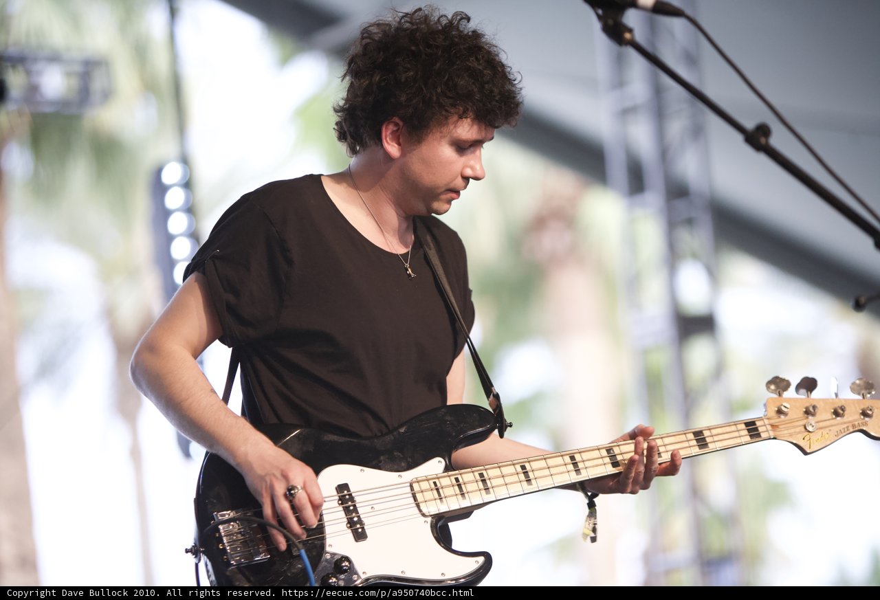 Curly-haired Bassist on Stage