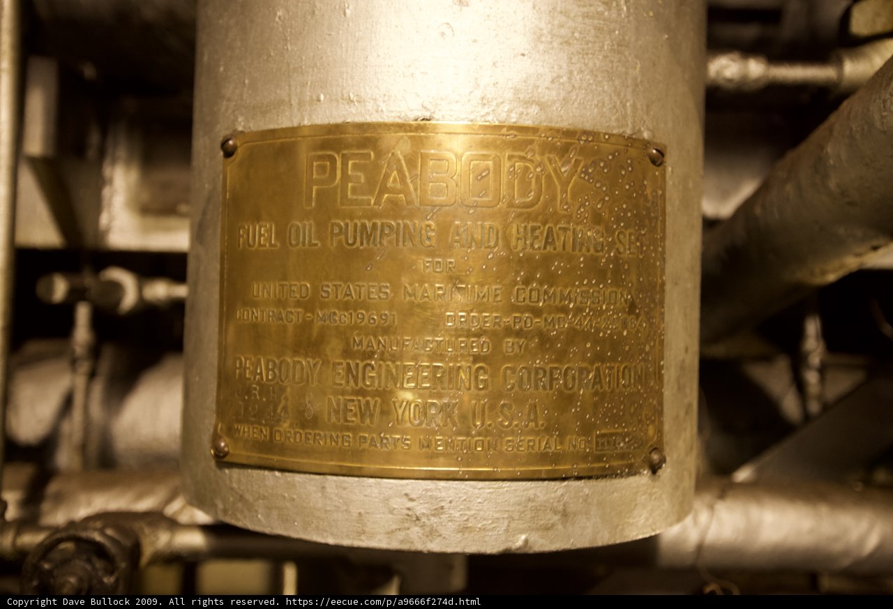 Golden Plaque on Industrial Pipe