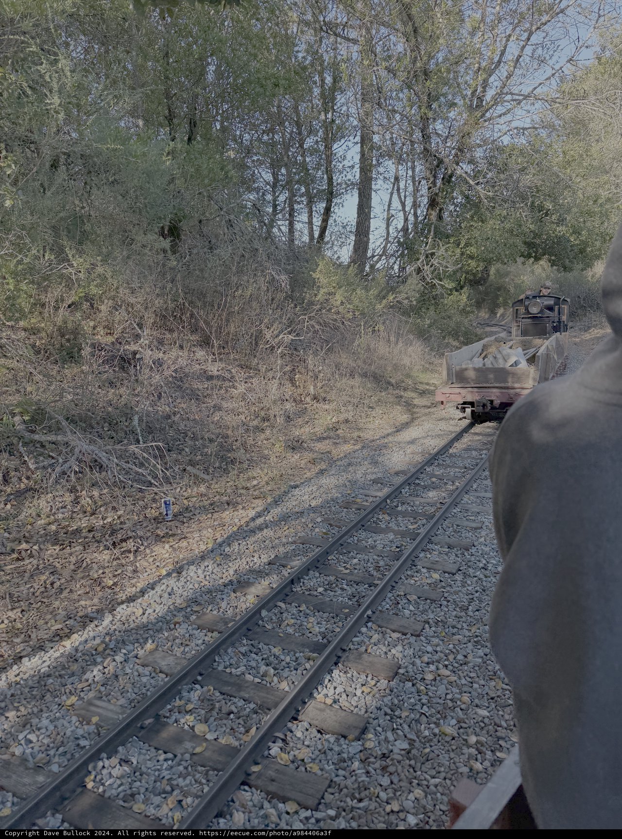 Vintage Railroad Car on Rural Tracks