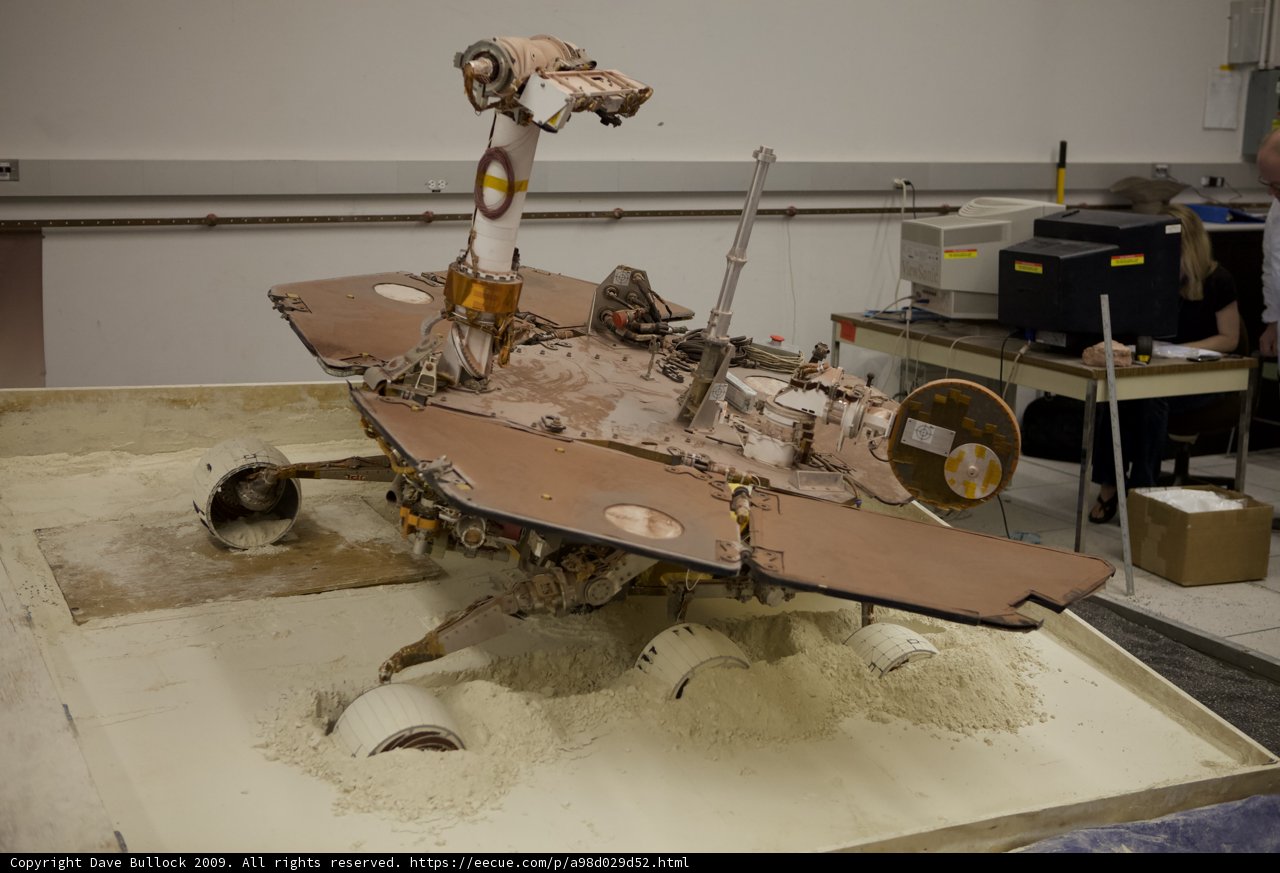 Miniature Rover Model on Wooden Table