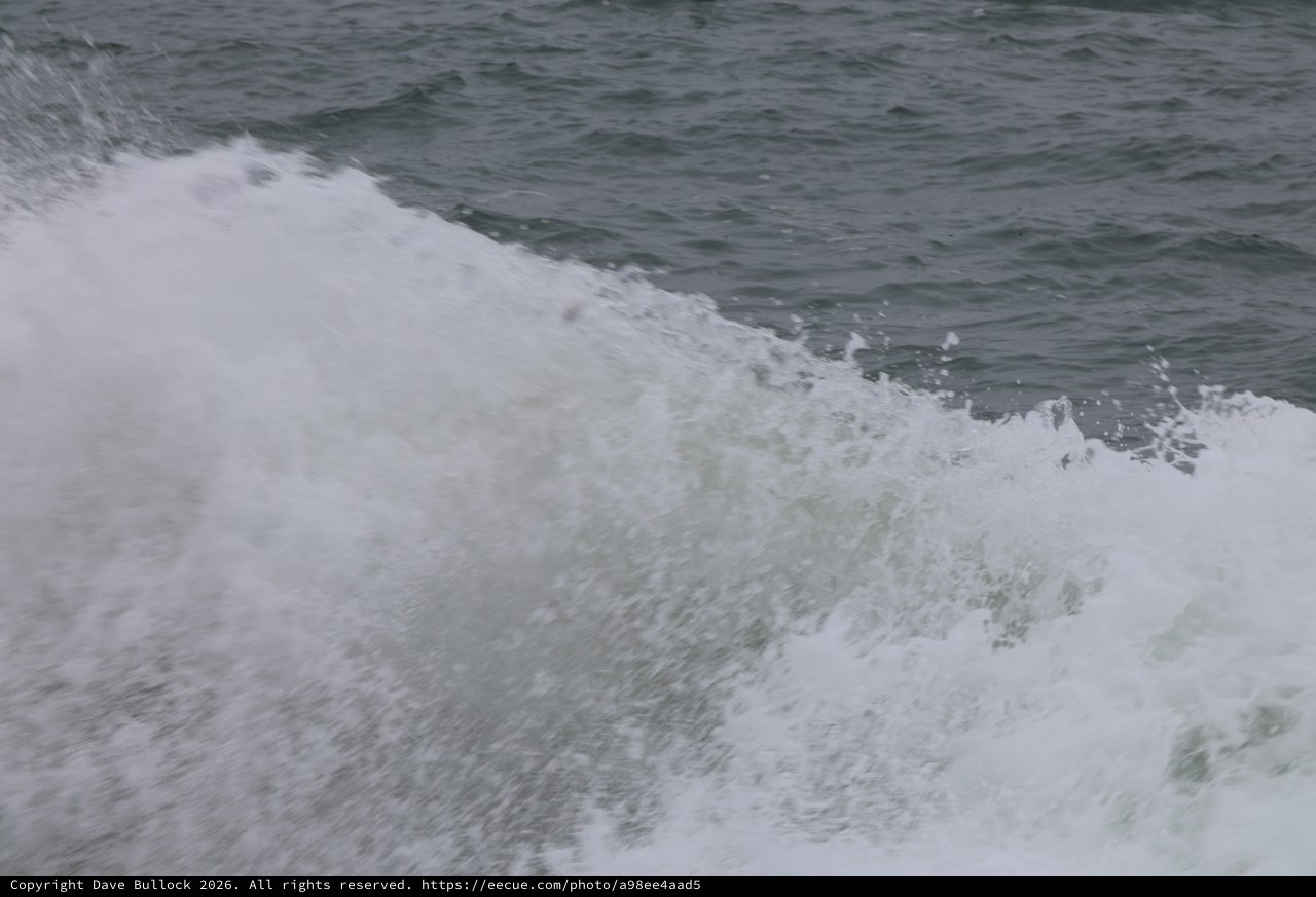 Churning Ocean Wake Crashes in Dramatic Foam