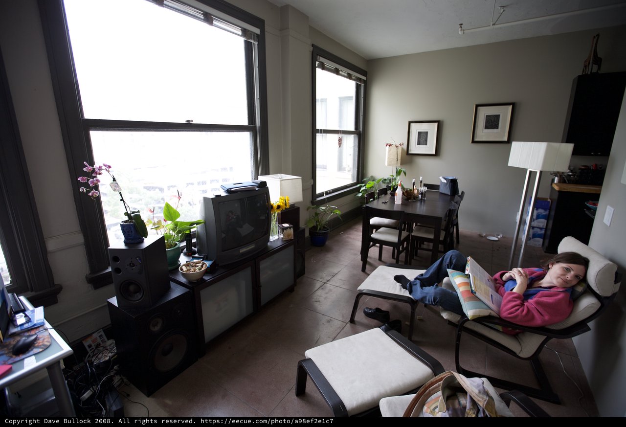 Woman Relaxing in Urban Apartment Living Room