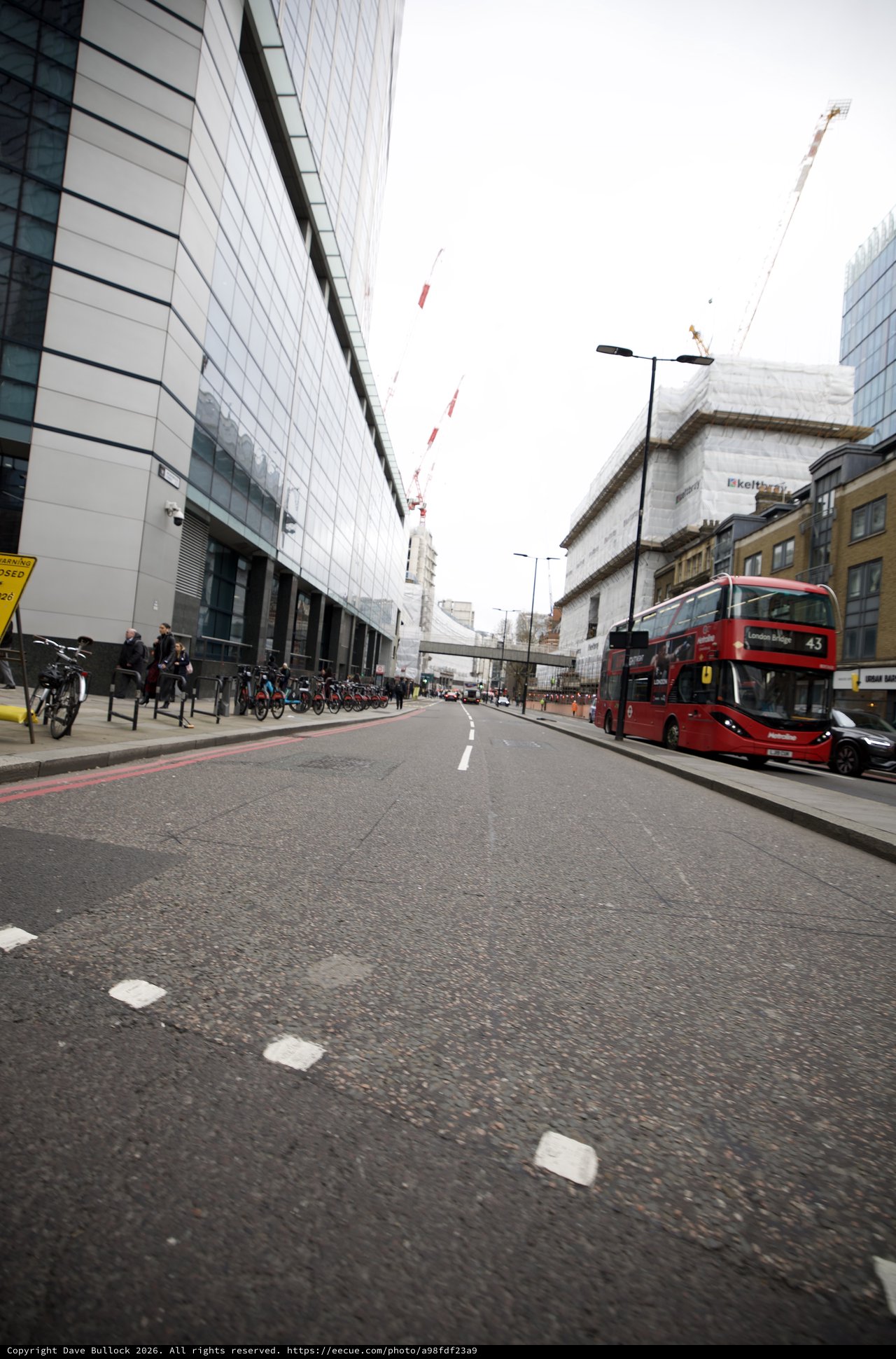 Red Double-Decker Bus on Modern London Street