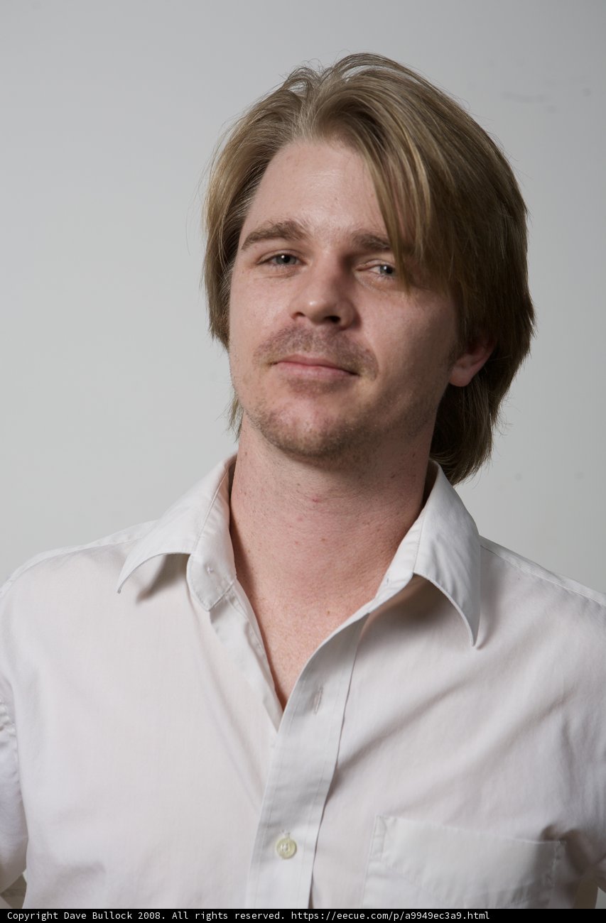 Portrait of a Happy man in a White Dress Shirt