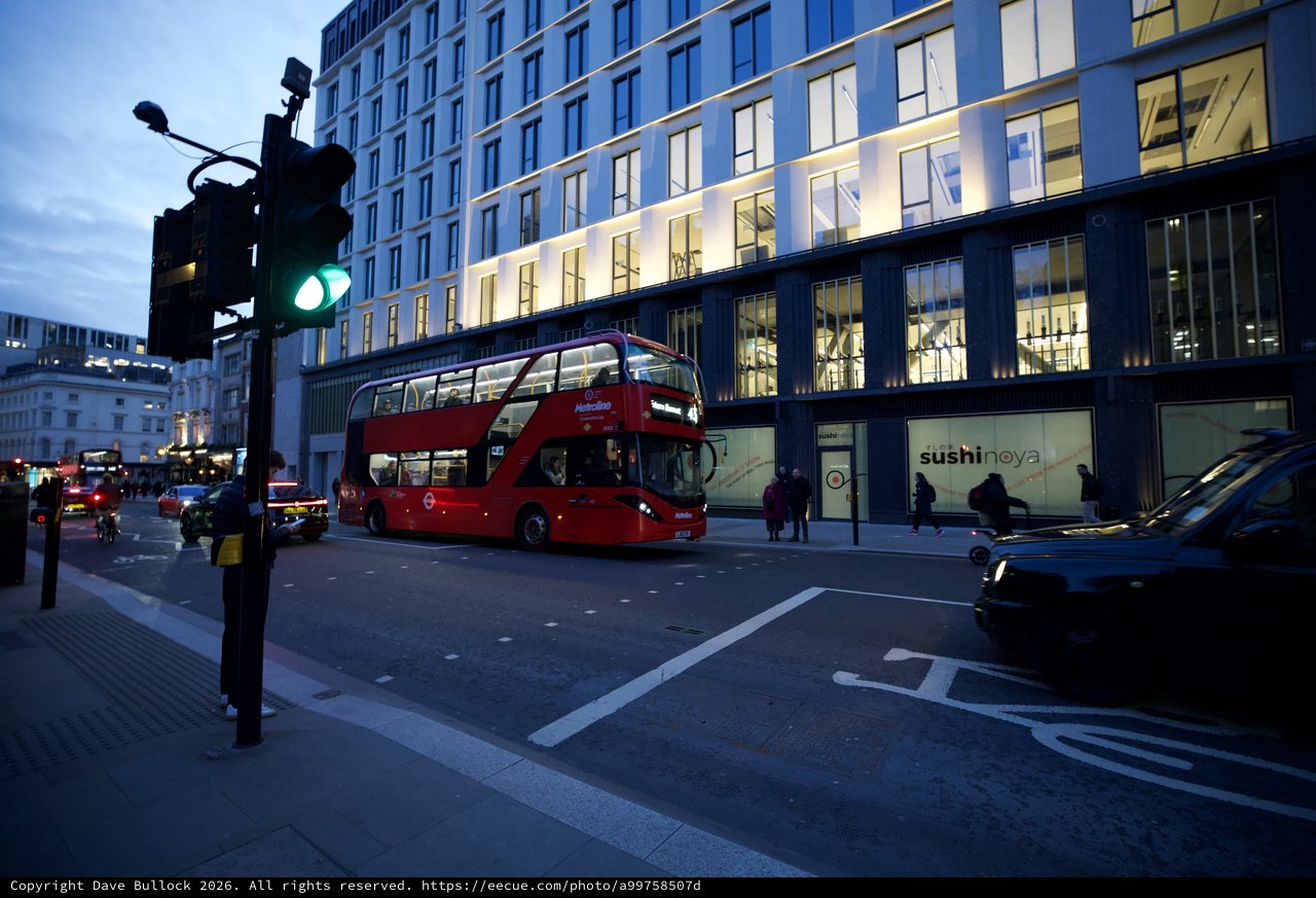 London Double-Decker Bus at Twilight Intersection