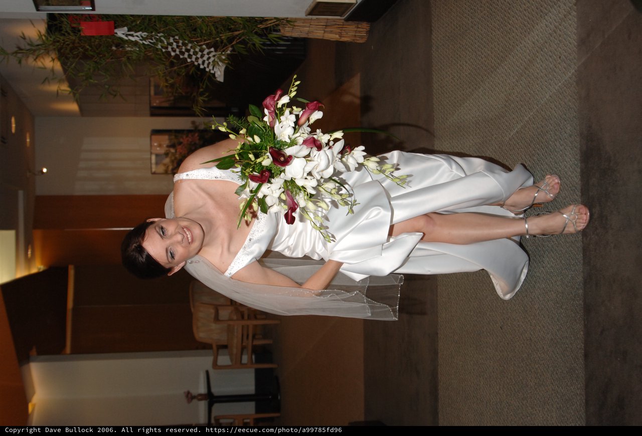Radiant Bride Walking with Cascading Floral Bouquet
