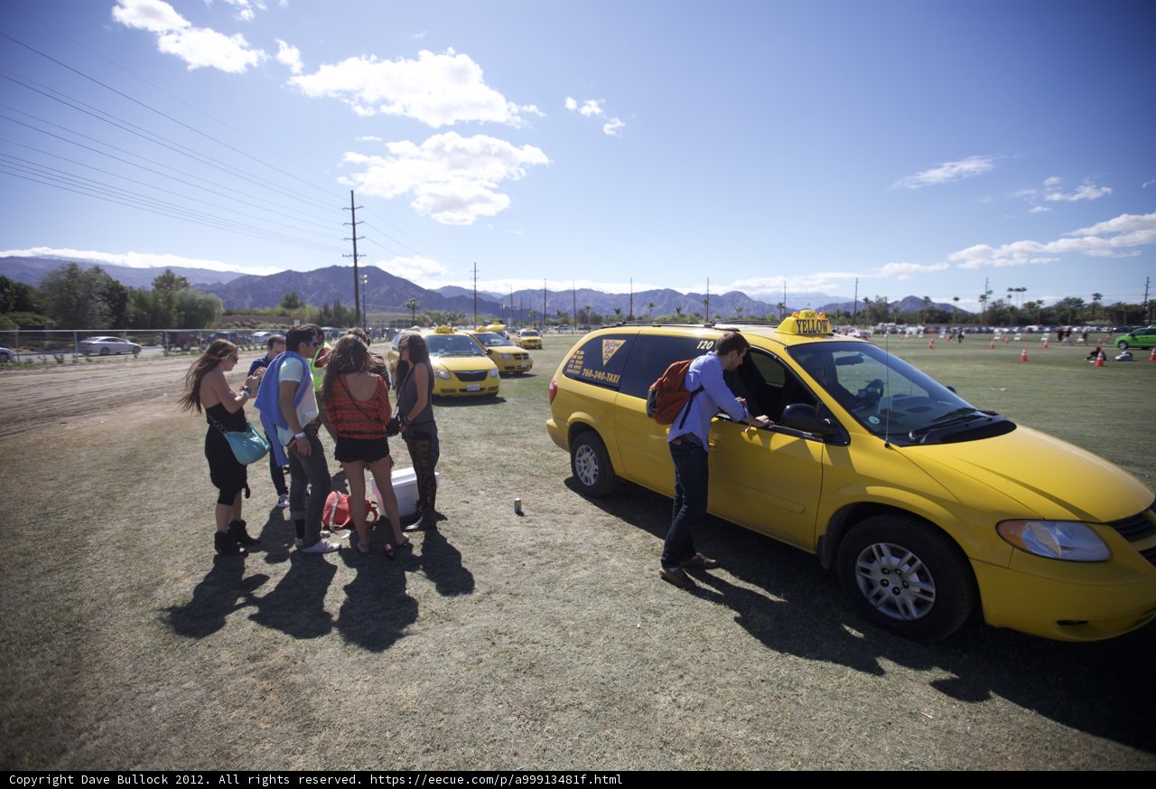 Yellow Taxi and a Group of People