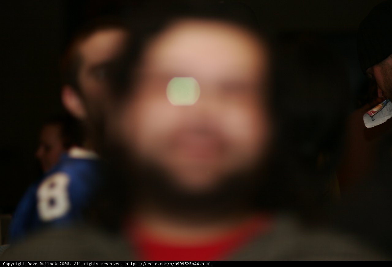 Blurry Man With Beard and Glasses