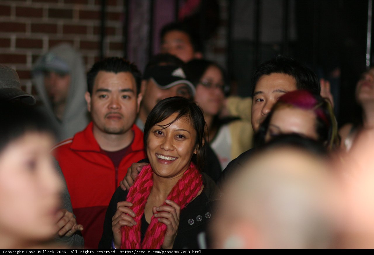 Woman's Joyful Moment in a Crowded Urban Club