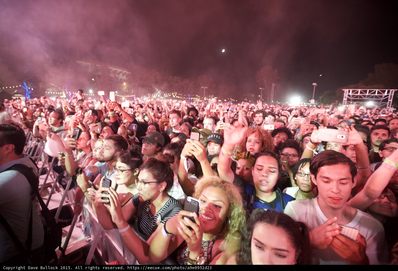 FYF Fest Wide Crowd Woman Curly Afro Hair Moon Night Phones Motel Shirt Pink Smoke Stage Scaffolding