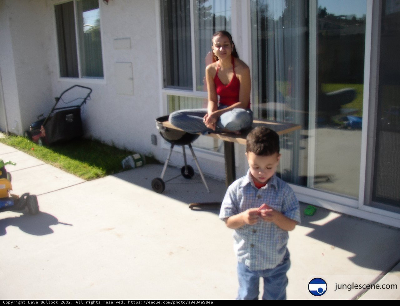 Mother and Son Enjoying a Sunny Afternoon on the Patio