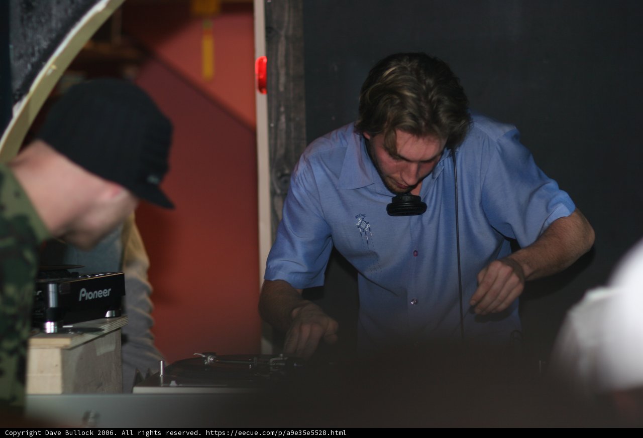 Blue Shirted DJ Showcasing His Talents