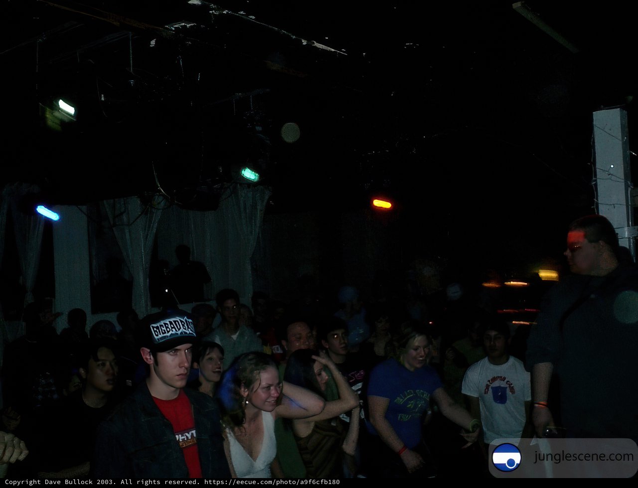 One Man Stands Out in a Crowd of Nightclub Goers