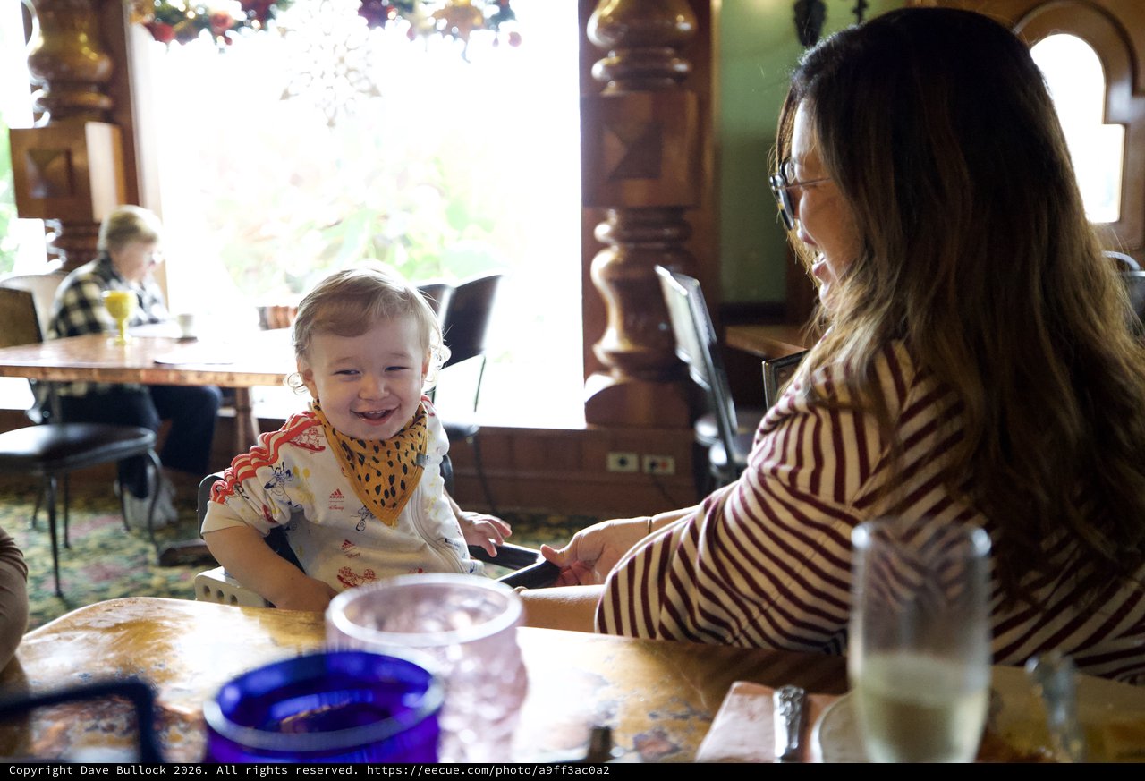 Mother and Toddler Sharing a Joyful Meal Together