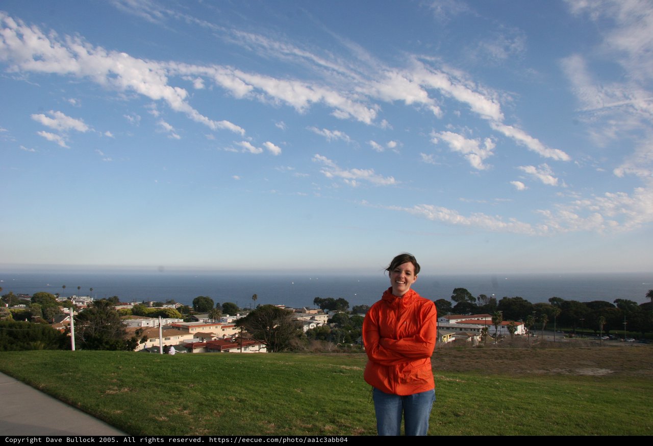 Woman in Red Jacket Overlooking Coastal California Town