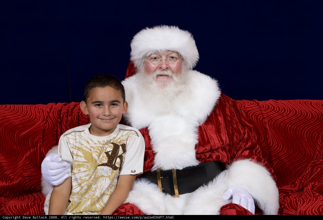 A boy and Santa on their favorite couch