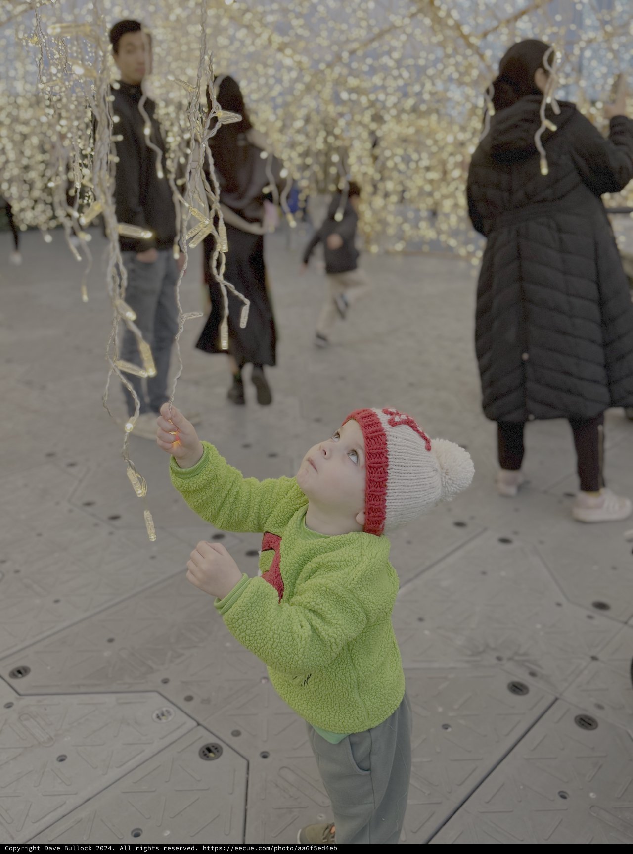 Child's Wonder Under Holiday Light Installation