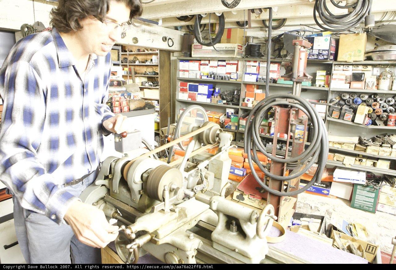 Working on a Lathe in a Factory Workshop