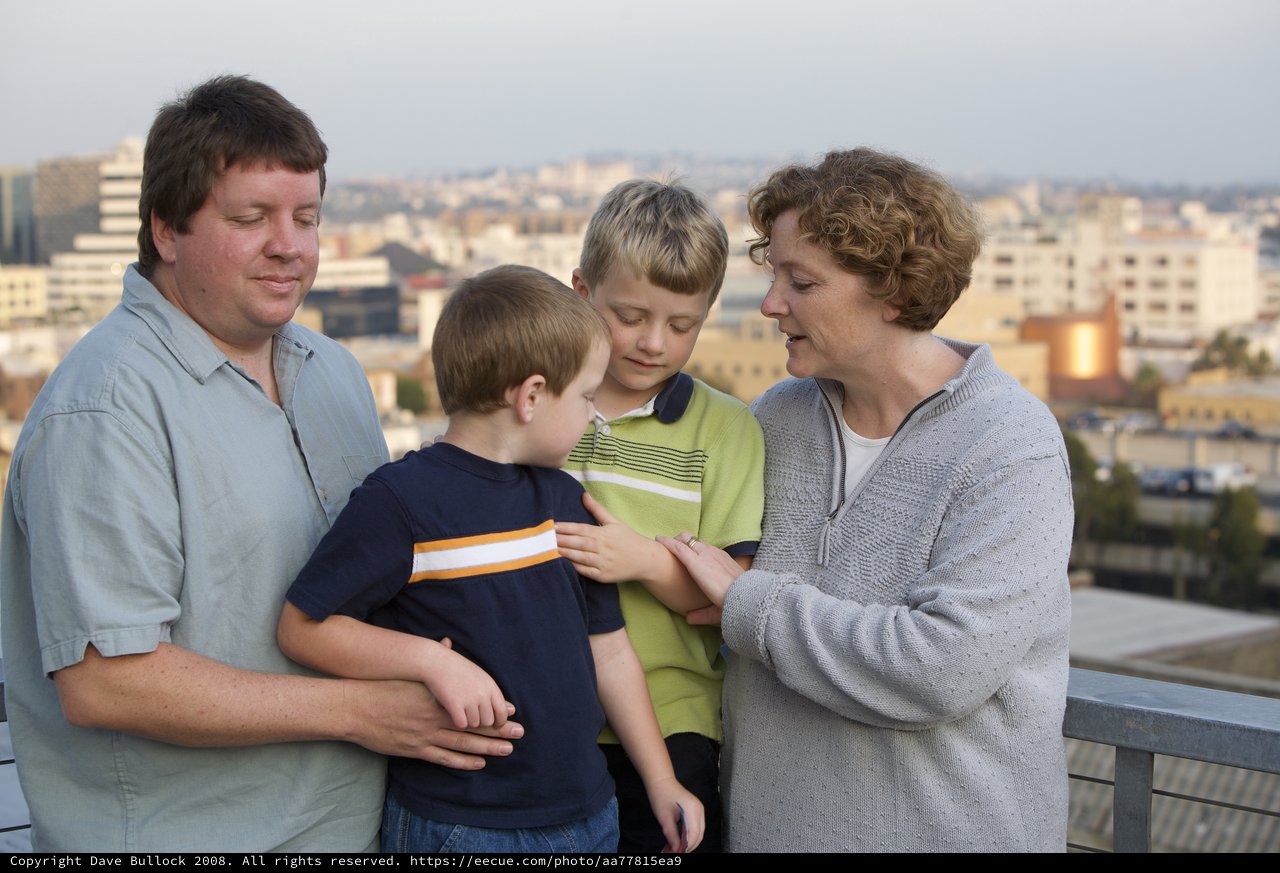 Family Moment on Urban Rooftop at Dusk
