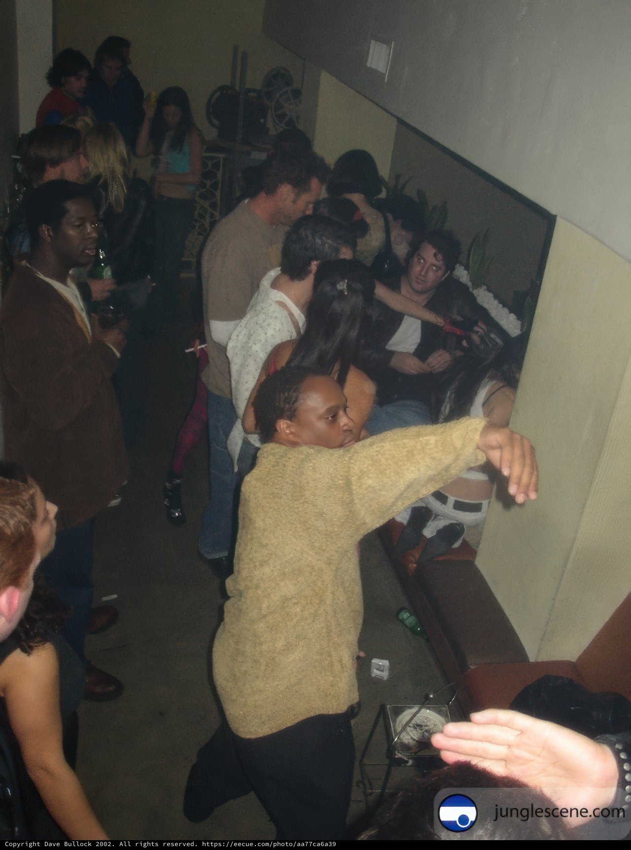 Woman in a Yellow Sweater at Night Club