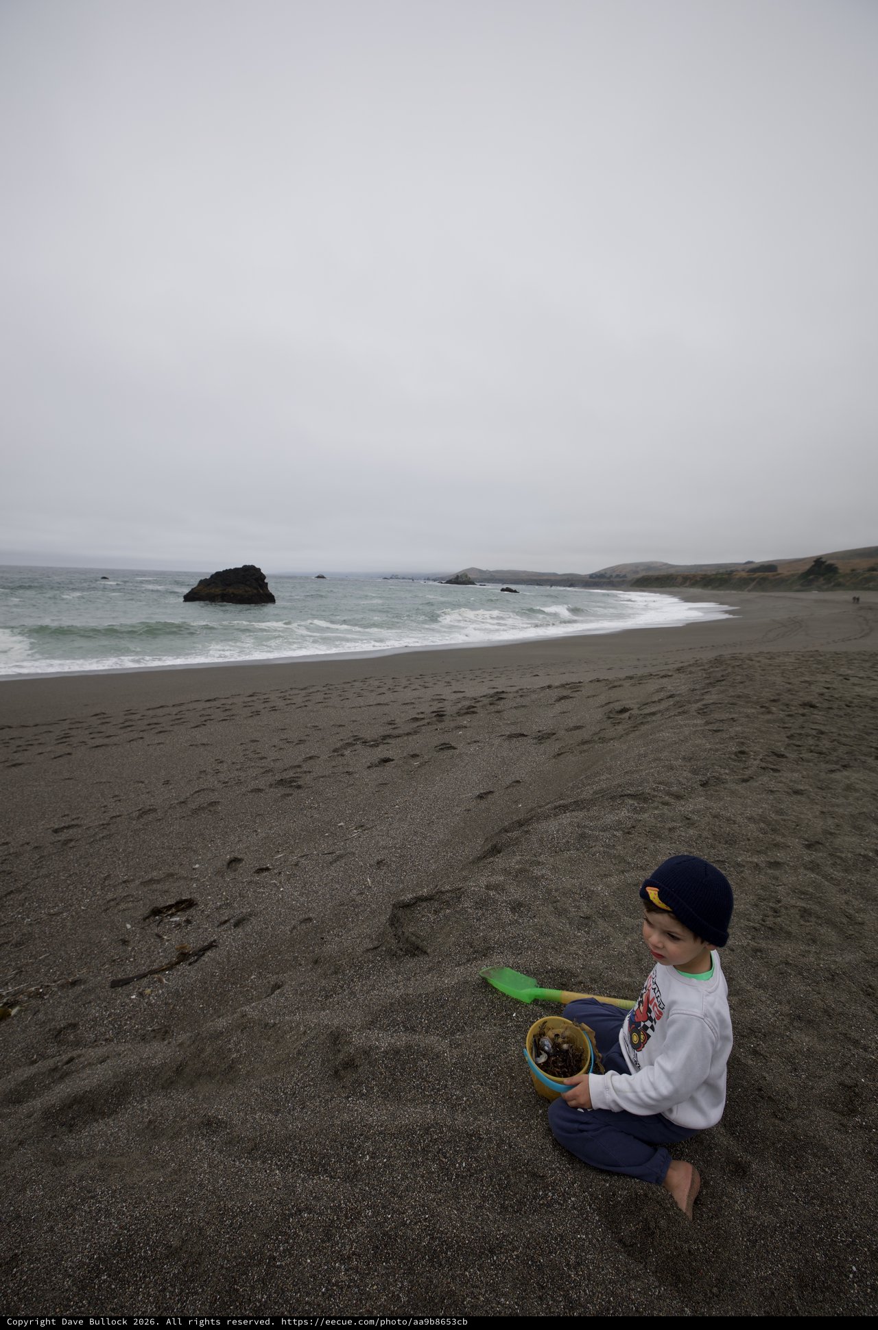 Young Child Playing on a Foggy Northern California Beach