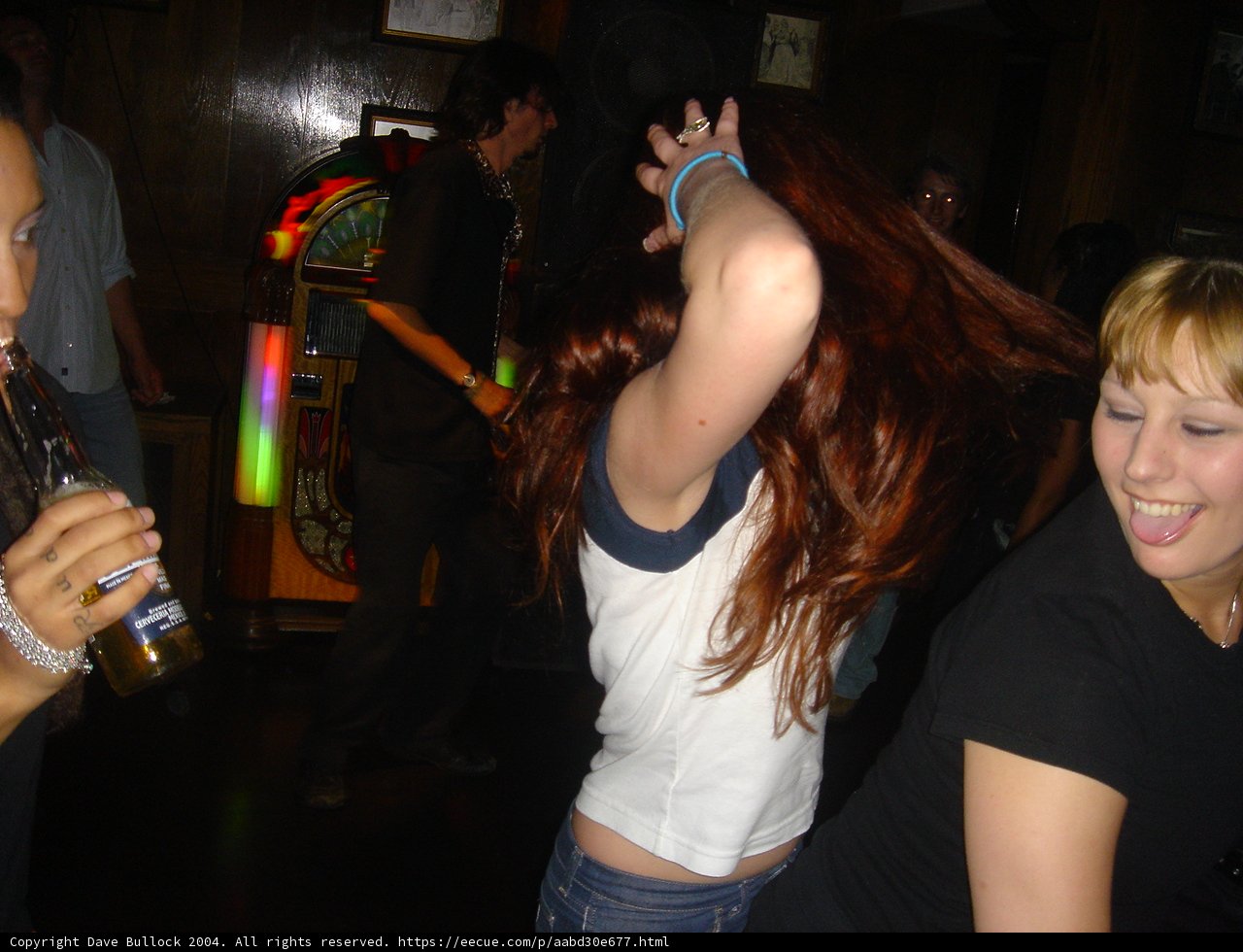 Red-Haired Beauty Enjoys Nightlife with Friends