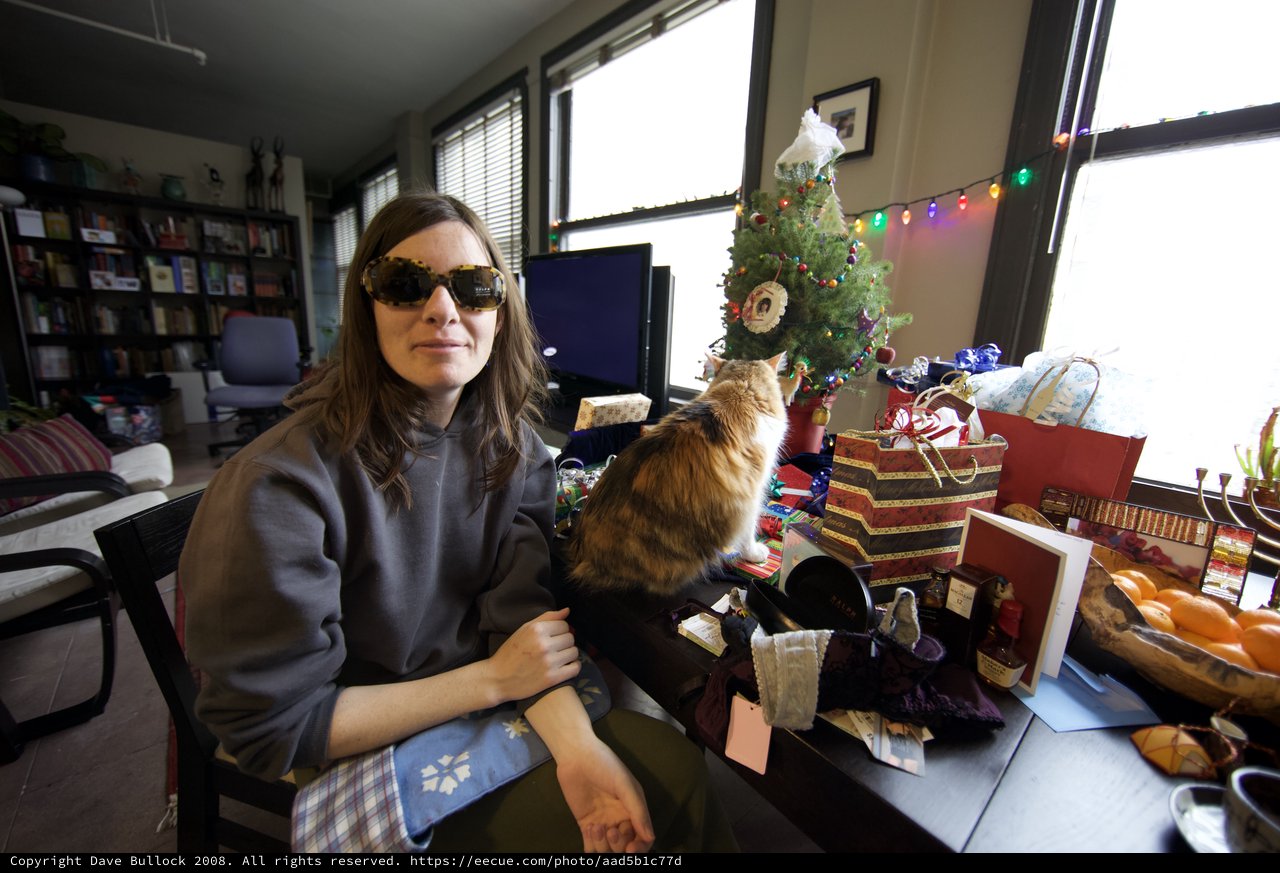 Penelope and Cat Amid Christmas Gifts and Cheer