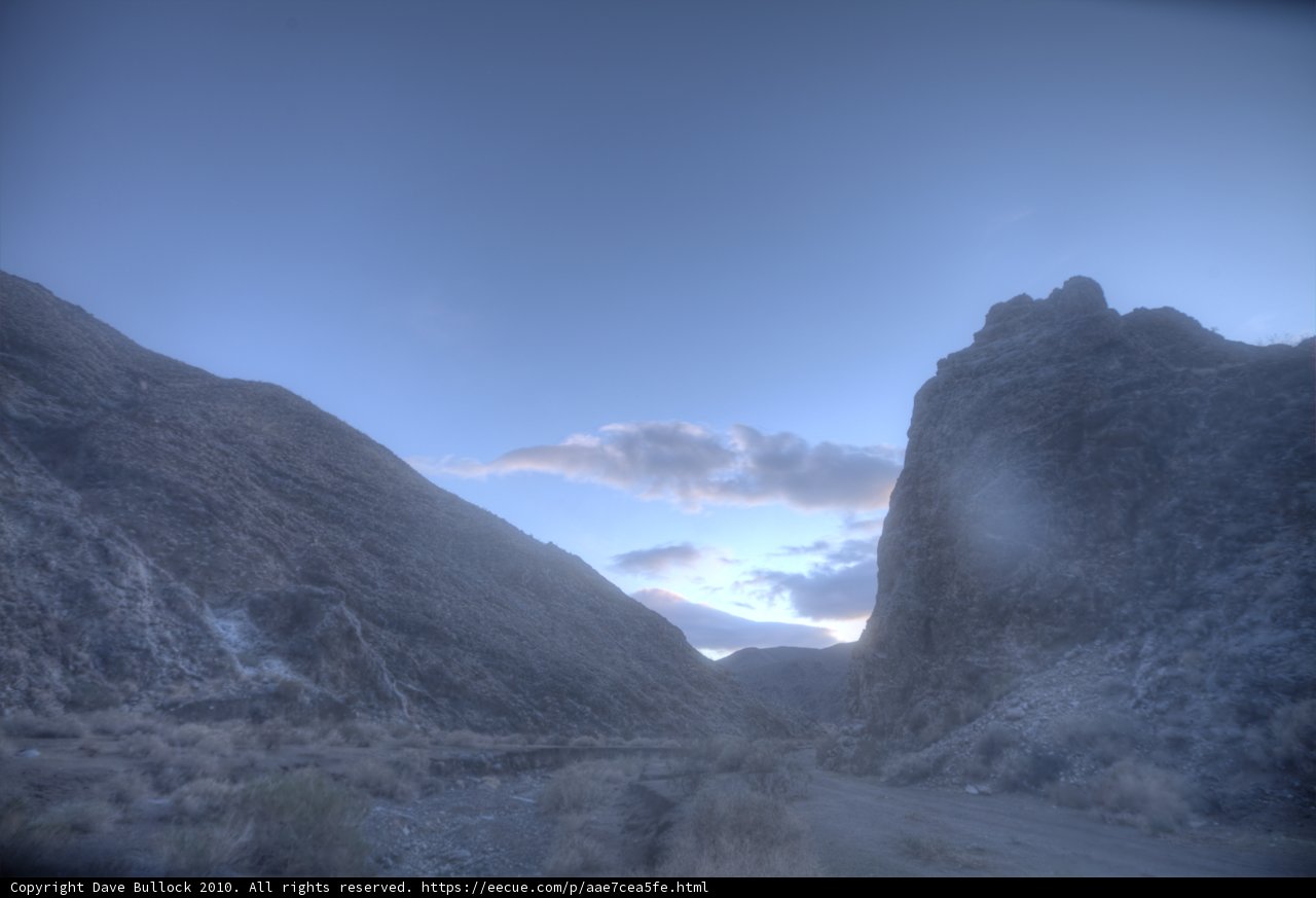 Majestic Peaks and Distant Road