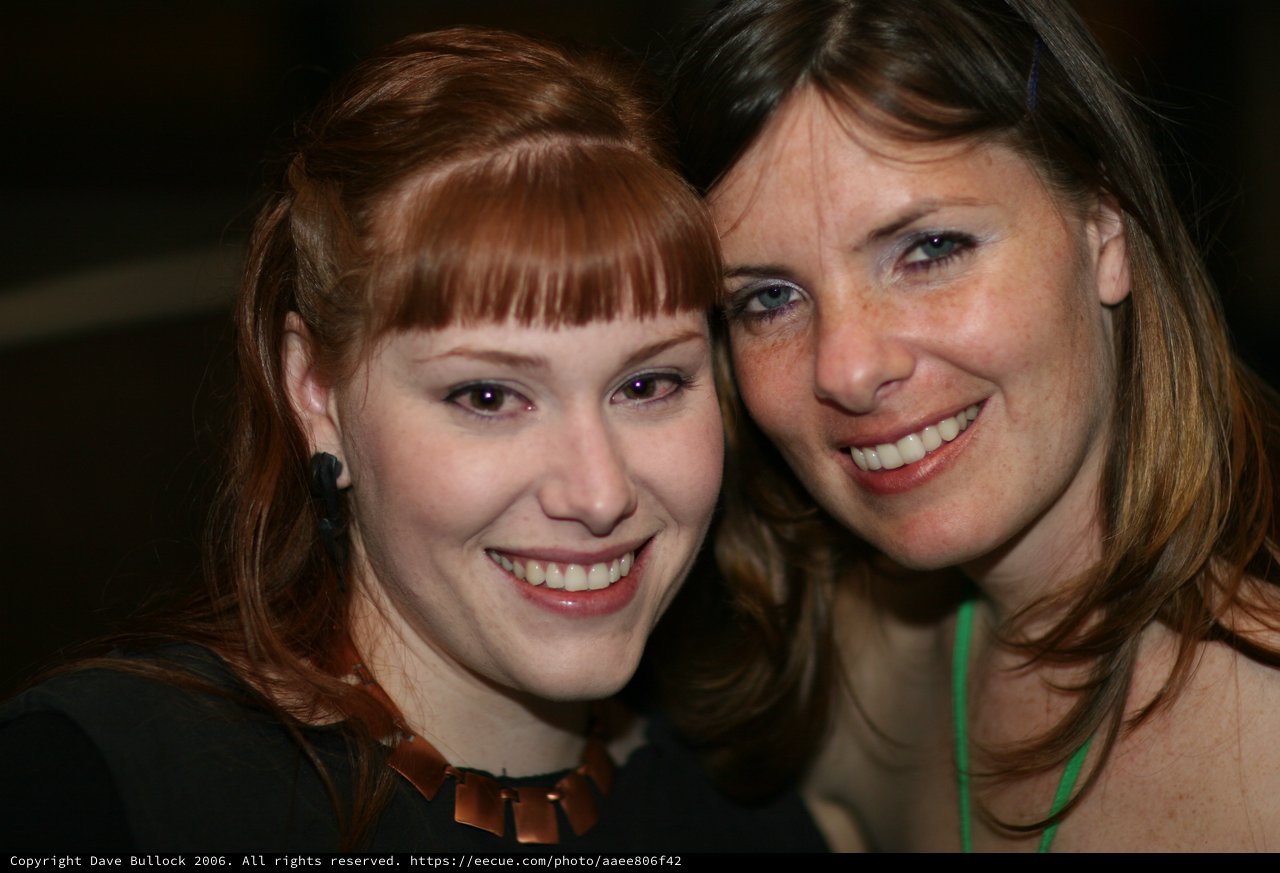 Two Smiling Women Share a Joyful Moment Together