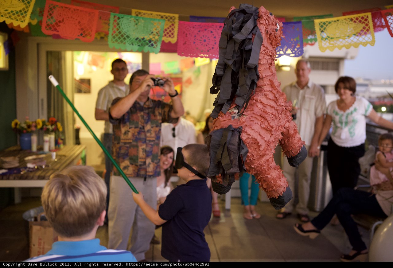 Blindfolded Boy Swings at Piñata at Fiesta Party