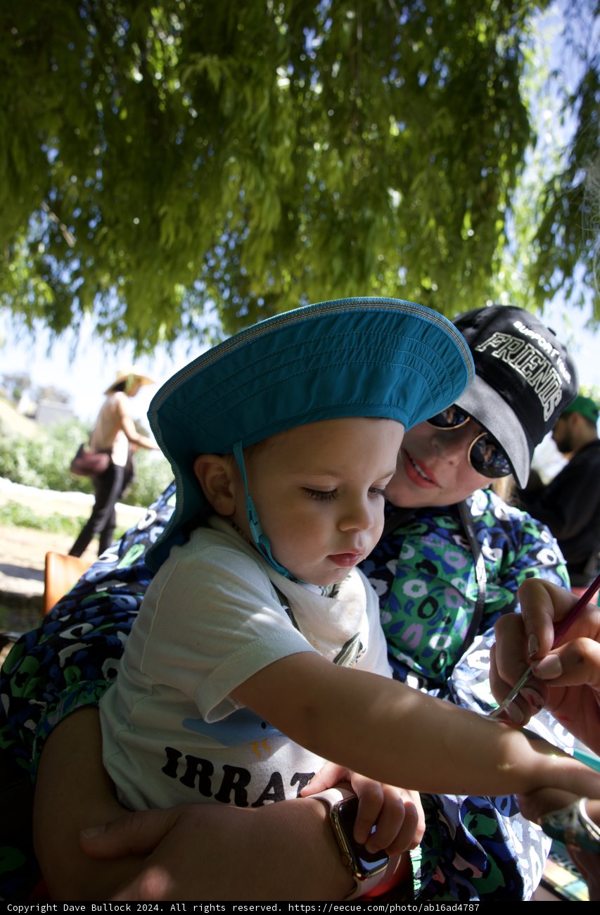 A Tender Moment Under the Shade
