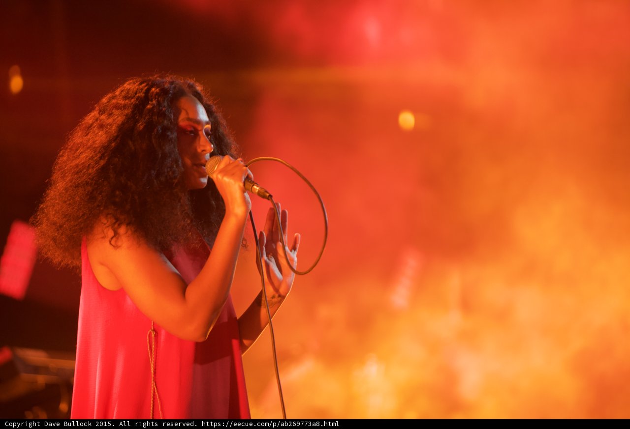 Solange Portrait Hand Gesture Singing Orange Smoke Atmospheric